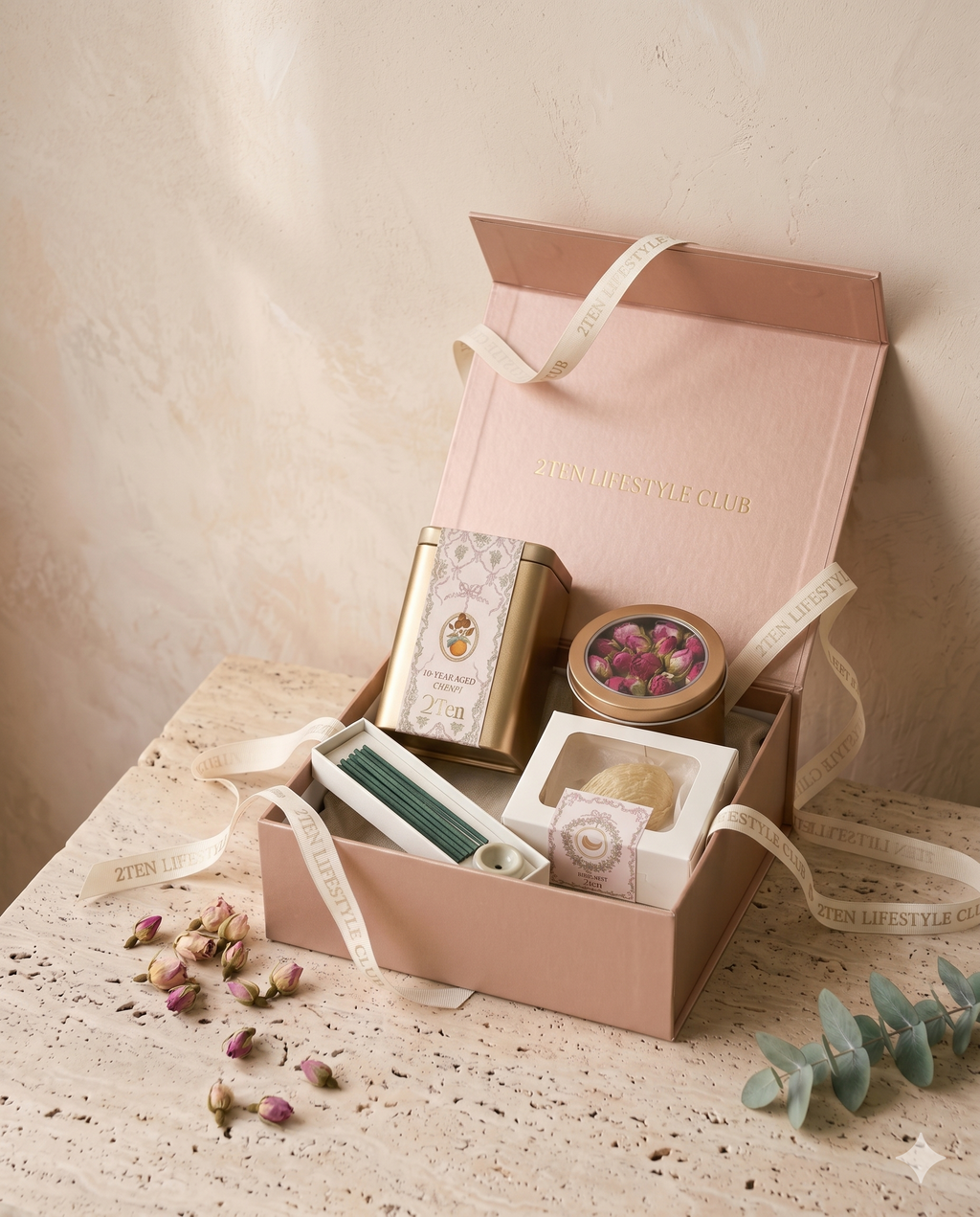 The Signature Wellness Set, open in its rose-gold box