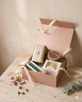 The Signature Wellness Set, open in its rose-gold box