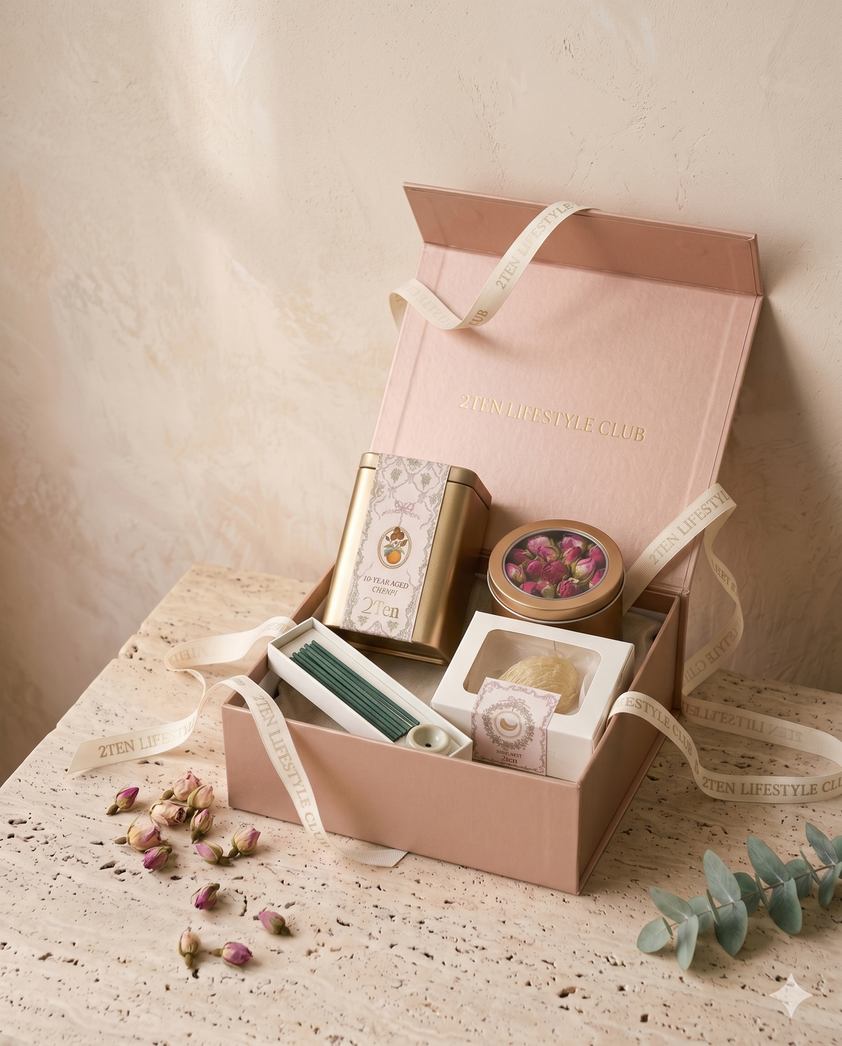 The Signature Wellness Set, open in its rose-gold box